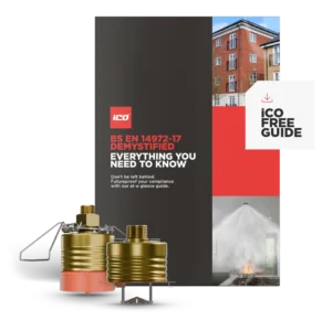 Cover of an ICD guide titled 'BS EN 14972-17 Demystified: Everything you need to know' with gas canisters in the foreground and a building collage on the right.